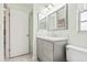 Gray vanity with marble countertop and a large mirror at 2465 Northside Dr # 205, Clearwater, FL 33761