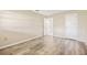 Spacious bedroom with light wood-look flooring and neutral walls at 2465 Northside Dr # 205, Clearwater, FL 33761