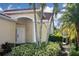 Inviting exterior with lush landscaping and a charming entrance at 311 Monaco Dr # 4, Punta Gorda, FL 33950