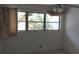 Simple bedroom with large window and neutral walls at 5593 40Th N Ave # 319, St Petersburg, FL 33709