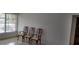 Dining area with three wooden chairs and large window at 5593 40Th N Ave # 319, St Petersburg, FL 33709