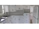 Efficient kitchen with white cabinets and appliances at 5593 40Th N Ave # 319, St Petersburg, FL 33709