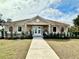 Community clubhouse with landscaping and walkway at 8333 Hardy Bay Loop, Wesley Chapel, FL 33545