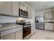 Modern kitchen featuring stainless steel appliances and granite countertops at 8333 Hardy Bay Loop, Wesley Chapel, FL 33545