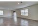 Spacious living room with tile floors and sliding glass doors at 8333 Hardy Bay Loop, Wesley Chapel, FL 33545