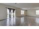 Bright and airy living room with tile floors and large window at 8333 Hardy Bay Loop, Wesley Chapel, FL 33545