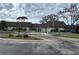 Community clubhouse with attractive landscaping at 2902 Oak Cir, Tarpon Springs, FL 34689