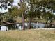 Serene pond with fountain and lush greenery at 2902 Oak Cir, Tarpon Springs, FL 34689