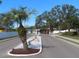 Landscaped entrance to a residential community at 35127 Danny Dr, Zephyrhills, FL 33541