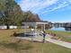 Lakeside gazebo with benches and bird bath at 35127 Danny Dr, Zephyrhills, FL 33541