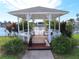 White gazebo overlooking a lake at 35127 Danny Dr, Zephyrhills, FL 33541