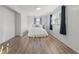 Bright bedroom with wood-look floors, a ceiling light, and natural light from two windows at 3637 63Rd N St, St Petersburg, FL 33710