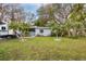 Updated ranch home with gray exterior and landscaping at 4026 Arkansas Ne Ave, St Petersburg, FL 33703