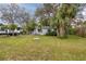 Cute gray house with palm trees and RV parking at 4026 Arkansas Ne Ave, St Petersburg, FL 33703