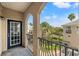 Private balcony with arched entryway and neighborhood view at 501 Knights Run Ave # 1217, Tampa, FL 33602