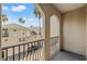 Private balcony with arched entryway and view of complex at 501 Knights Run Ave # 1217, Tampa, FL 33602