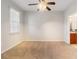 Spacious bedroom featuring a ceiling fan and large window at 501 Knights Run Ave # 1217, Tampa, FL 33602