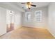 Bright bedroom with ceiling fan and neutral carpeting at 501 Knights Run Ave # 1217, Tampa, FL 33602