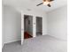 Bedroom with carpet, ceiling fan, and walk-in closet at 501 Knights Run Ave # 1217, Tampa, FL 33602