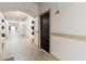 Building hallway with arched entryways and potted plants at 501 Knights Run Ave # 1217, Tampa, FL 33602