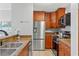 Modern kitchen with stainless steel appliances and granite countertops at 501 Knights Run Ave # 1217, Tampa, FL 33602