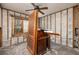 A room under renovation with exposed walls and a wooden cabinet at 635 Hudson Ave, Tampa, FL 33606