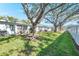 Spacious backyard with lush lawn and mature trees at 11200 102Nd N Ave # 66, Seminole, FL 33778