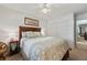 Bedroom with wooden headboard and leafy bedding at 11200 102Nd N Ave # 66, Seminole, FL 33778