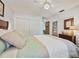 Bedroom with double closet and soft bedding at 11200 102Nd N Ave # 66, Seminole, FL 33778