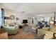 Cozy living room featuring comfortable seating, soft colors, and a view into the dining area for easy entertaining at 11200 102Nd N Ave # 66, Seminole, FL 33778