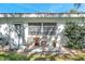 Small patio with table and chairs, next to the building at 11200 102Nd N Ave # 66, Seminole, FL 33778