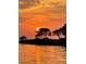 Stunning sunset over the water, showcasing the property's waterfront location at 209 Westwinds Dr, Palm Harbor, FL 34683