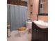 Updated bathroom with shower/tub, vanity, and tile at 855 Pinewood W Ter, Palm Harbor, FL 34683
