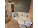 Bathroom with a bathtub, toilet, and tiled floors at 855 Pinewood W Ter, Palm Harbor, FL 34683