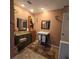 Updated bathroom with a pedestal sink and tiled floor at 855 Pinewood W Ter, Palm Harbor, FL 34683