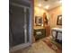 Bathroom with shower, vanity, and tiled floor at 855 Pinewood W Ter, Palm Harbor, FL 34683