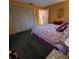 Bedroom with double bed, built-in closet, and carpet at 855 Pinewood W Ter, Palm Harbor, FL 34683