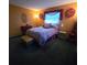 Well-lit bedroom with a double bed and rich decor at 855 Pinewood W Ter, Palm Harbor, FL 34683
