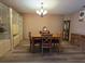 Charming dining room with hardwood floors and a chandelier at 855 Pinewood W Ter, Palm Harbor, FL 34683