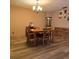 Bright dining room with hardwood floors and a chandelier at 855 Pinewood W Ter, Palm Harbor, FL 34683