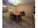 Spacious dining room with hardwood floors and built-in hutch at 855 Pinewood W Ter, Palm Harbor, FL 34683