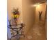 Bright hallway with decorative accents and tile floors at 855 Pinewood W Ter, Palm Harbor, FL 34683