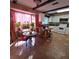Eat-in kitchen with white cabinets, tile floors and breakfast nook at 855 Pinewood W Ter, Palm Harbor, FL 34683