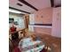 Kitchen boasts white cabinets, tile floors, and an island at 855 Pinewood W Ter, Palm Harbor, FL 34683