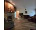 Bright living room with hardwood floors and a stone fireplace at 855 Pinewood W Ter, Palm Harbor, FL 34683