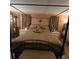 Main bedroom features a king-size bed, and elegant decor at 855 Pinewood W Ter, Palm Harbor, FL 34683