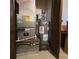 Home mechanical room, showing water heater and HVAC unit at 855 Pinewood W Ter, Palm Harbor, FL 34683