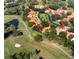 Aerial view of a community with golf course and villas at 1120 Tartan Dr, Palm Harbor, FL 34684