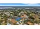 Community overview, featuring a clubhouse, pool, and tennis courts at 1120 Tartan Dr, Palm Harbor, FL 34684