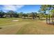 Community overview showcasing homes, golf course, and river at 1120 Tartan Dr, Palm Harbor, FL 34684